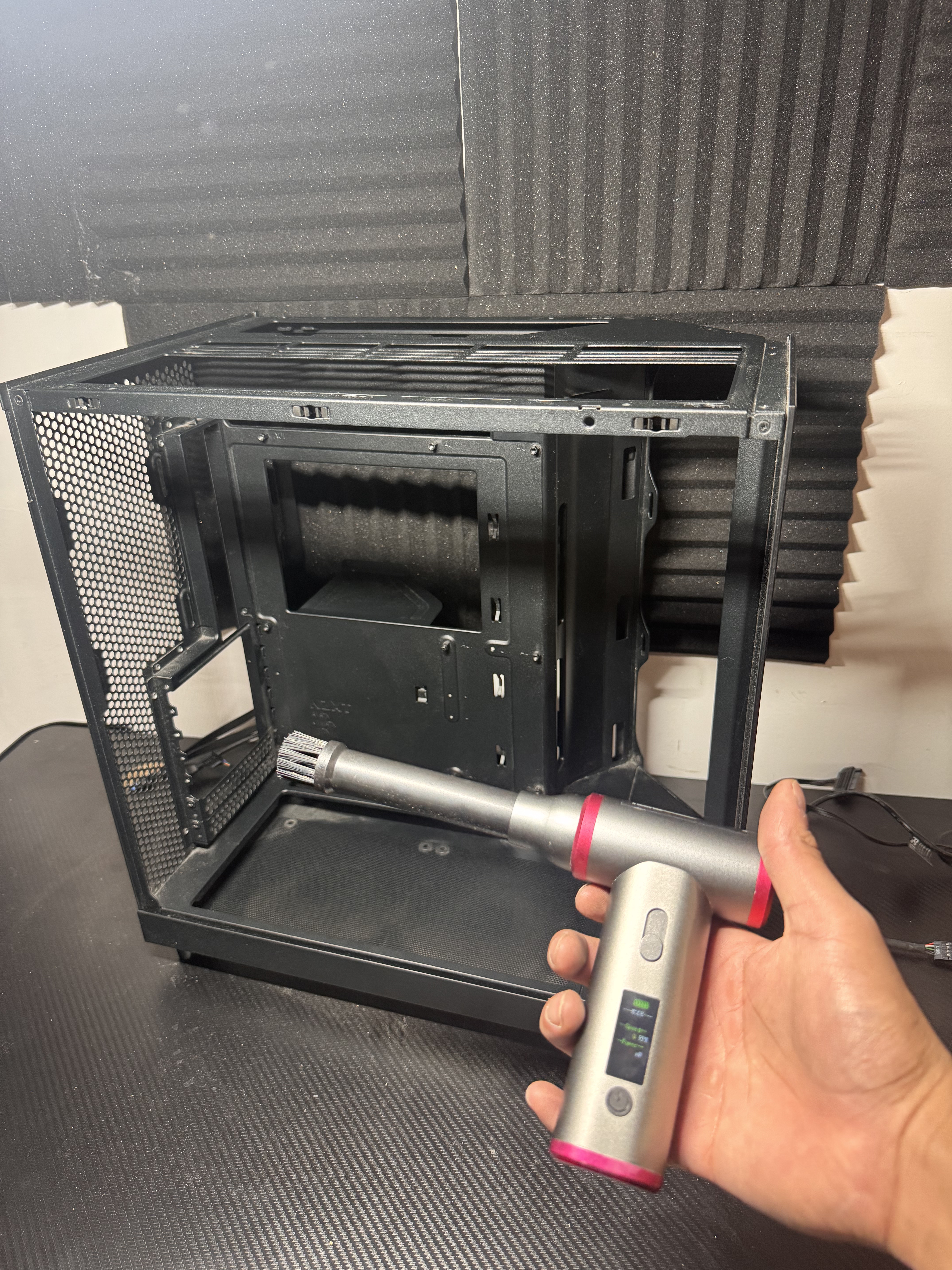 PC case being cleaned with an air blower