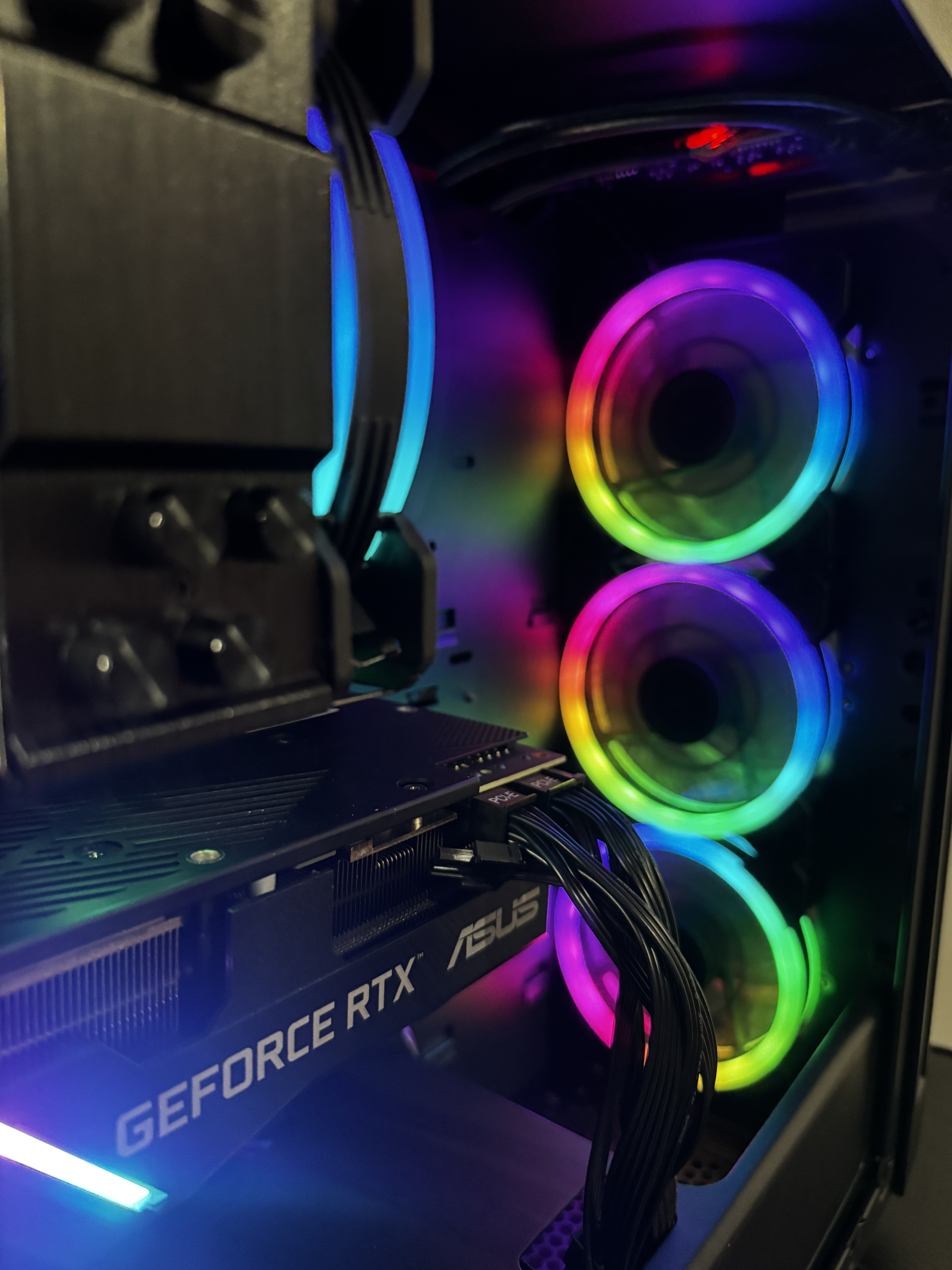 Close-up of RGB fans and graphics card inside a PC